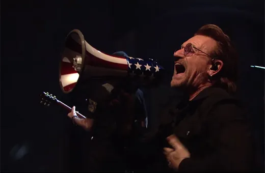 man singing into a megaphone